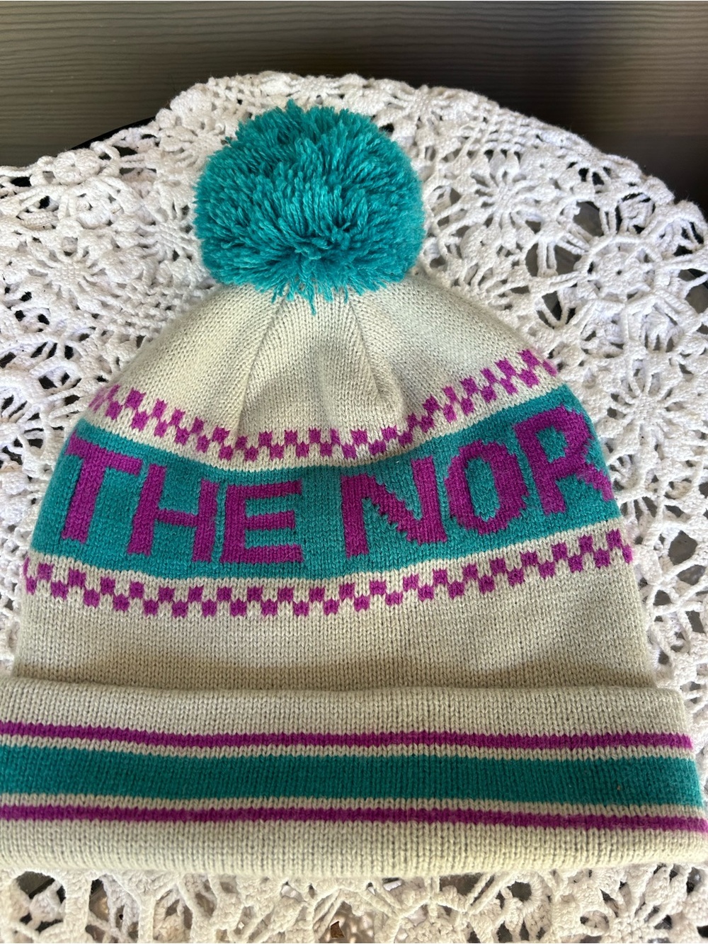 The North Face Cream Beanie with Teal Pom and Magenta Lettering